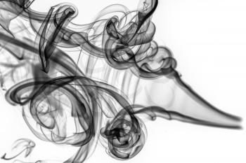 Abstract pattern: black smoke swirls and curves on white