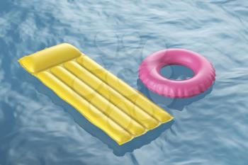 Pool raft and swim ring floating on wavy water 