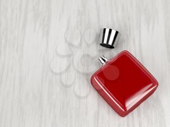 Red perfume bottle on wood background 