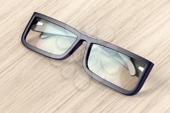 Eyeglasses with black frame on wood background
