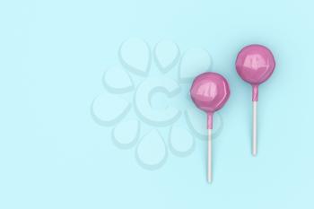 Top view of two pink lollipops on turquoise background
