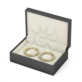 Box with gold wedding rings on white background