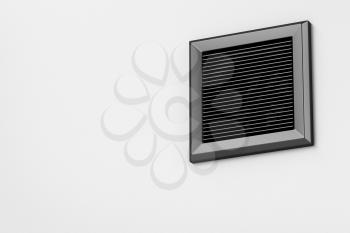 Black electric exhaust fan on the wall