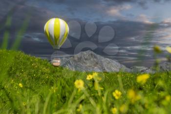 Flying hot-air balloon over the grass field, 3d rendering. Computer digital drawing.