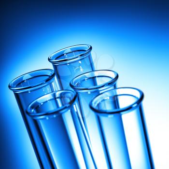 Test Tube Close up. Row of Test Tubes in Blue Tone - Medical Background.