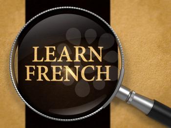 Learn French through Lens on Old Paper with Black Vertical Line Background. 3D Render.