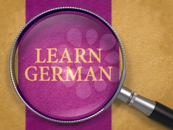 Learn German through Lens on Old Paper with Dark Lilac Vertical Line Background. 3D Render.