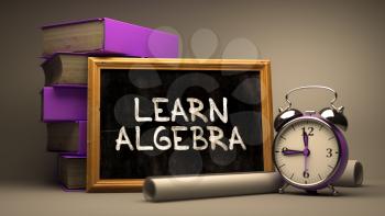 Learn Algebra - Chalkboard with Hand Drawn Text, Stack of Books, Alarm Clock and Rolls of Paper on Blurred Background. Toned Image. 3D Render.
