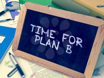 Time for Plan B Handwritten on Chalkboard. Composition with Small Chalkboard on Background of Working Table with Ring Binders, Office Supplies, Reports. Blurred Background. Toned Image. 3D Render.