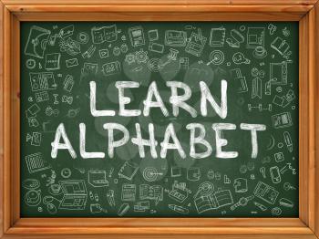 Learn Alphabet Concept. Line Style Illustration. Learn Alphabet Handwritten on Green Chalkboard with Doodle Icons Around. Doodle Design Style of  Learn Alphabet.