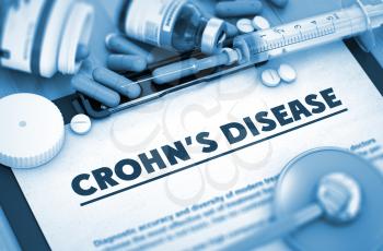 Crohn's Disease - Printed Diagnosis with Blurred Text. Crohn's Disease, Medical Concept with Pills, Injections and Syringe. 3D Render.
