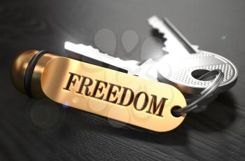 Keys to Freedom - Concept on Golden Keychain over Black Wooden Background. Closeup View, Selective Focus, 3D Render.