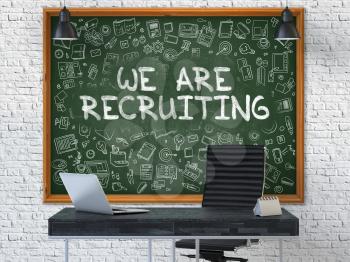 We are Recruiting - Handwritten Inscription by Chalk on Green Chalkboard with Doodle Icons Around. Business Concept in the Interior of a Modern Office on the White Brick Wall Background. 3D.