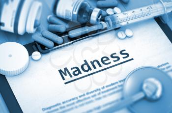 Madness - Printed Diagnosis with Blurred Text. Madness Diagnosis, Medical Concept. Composition of Medicaments. Madness, Medical Concept with Pills, Injections and Syringe. Toned Image. 3D Render.