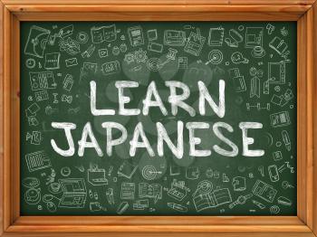 Hand Drawn Learn Japanese on Green Chalkboard. Hand Drawn Doodle Icons Around Chalkboard. Modern Illustration with Line Style.