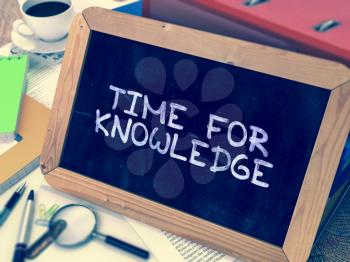 Time for Knowledge Concept Hand Drawn on Chalkboard on Working Table Background. Blurred Background. Toned Image. 3D Render.