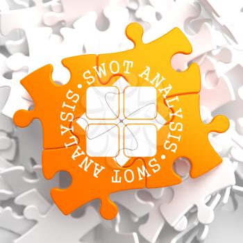 SWOT Analisis Written Arround Icon on Orange Puzzle. Business Concept.