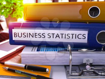 Business Statistics - Blue Office Folder on Background of Working Table with Stationery and Laptop. Business Statistics Business Concept on Blurred Background. Business Statistics Toned Image. 3D.