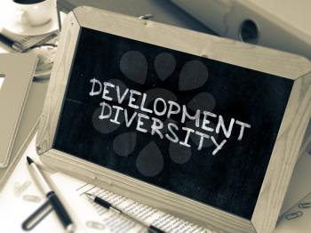 Development Diversity Concept Hand Drawn on Chalkboard on Working Table Background. Blurred Background. Toned Image. 3D Render.