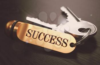 Keys to Success - Golden Keychain over Black Wooden Background. Closeup View, Selective Focus, 3D Render. Toned Image.