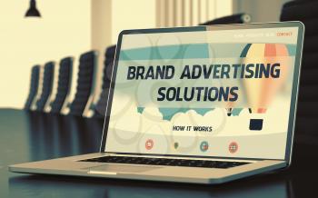 Brand Advertising Solutions on Landing Page of Laptop Screen. Closeup View. Modern Conference Hall Background. Toned. Blurred Image. 3D Illustration.