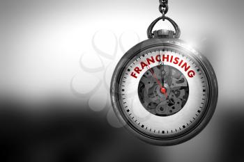 Business Concept: Pocket Watch with Franchising - Red Text on it Face. Vintage Pocket Watch with Franchising Text on the Face. 3D Rendering.