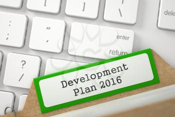Development Plan 2016 written on Green Folder Index Concept on Background of White PC Keyboard. Closeup View. Blurred Illustration. 3D Rendering.