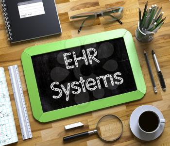 EHR - Electronic Health Record Systems, Handwritten on Small Chalkboard. Green Small Chalkboard with Handwritten Business Concept - EHR Systems. Top View. 3d Rendering.