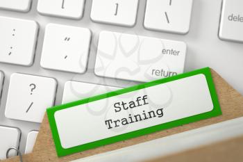 Staff Training Concept. Word on Green Folder Register of Card Index. Closeup View. Selective Focus. 3D Rendering.