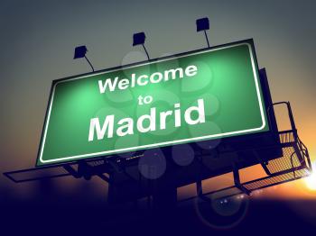 Welcome to Madrid - Green Billboard on the Rising Sun Background.