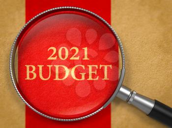 2021 Budget Concept through Magnifier on Old Paper with Red Vertical Line Background.