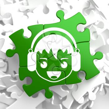 Happy Boy with Headphones Icon on Green Puzzle. Sound, Music Concept.