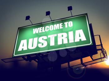 Welcome to Austria - Green Billboard on the Rising Sun Background.