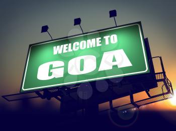 Welcome to Goa - Green Billboard on the Rising Sun Background.