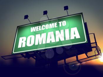 Welcome to Romania - Green Billboard on the Rising Sun Background.