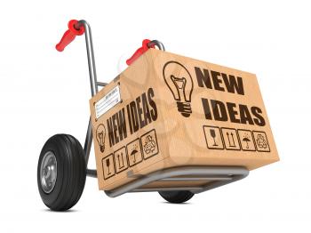 New Ideas Slogan on Cardboard Box on Hand Truck White Background.