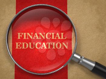 Financial Education concept. Magnifying Glass on Old Paper with Red Vertical Line Background.