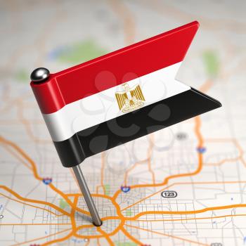 Small Flag of Egypt Sticked in the Map Background with Selective Focus.