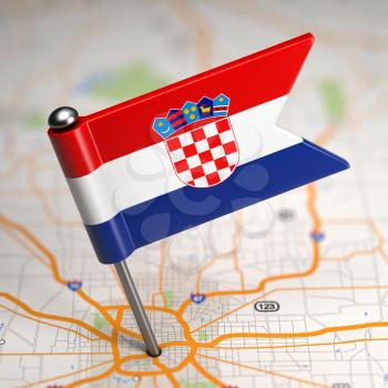 Small Flag of Croatia on a Map Background with Selective Focus.