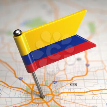Small Flag of Colombia on a Map Background with Selective Focus.