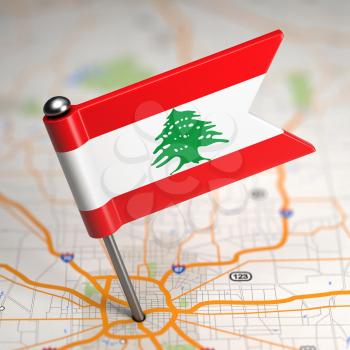 Small Flag of Lebanon on a Map Background with Selective Focus.