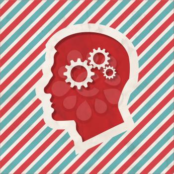Psychological Concept - Profile of Head with Cogwheel Gear Mechanism - on Red and Blue Striped Background. Vintage Concept in Flat Design.