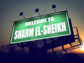 Welcome to Sharm el-Sheikh - Green Billboard on the Rising Sun Background.