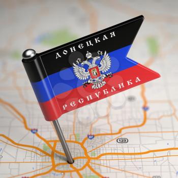 Small Flag of Donetsk People's Republic- Sticked in the Map Background with Selective Focus.