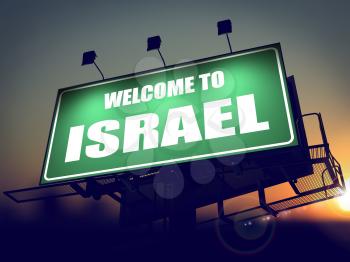 Welcome to Israel - Green Billboard on the Rising Sun Background.