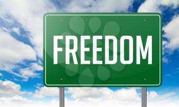 Highway Signpost with Freedom wording on Sky Background,