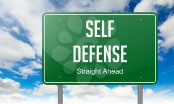Highway Signpost with Self Defense wording on Sky Background.