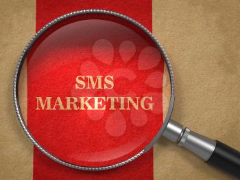SMS Marketing through Magnifying Glass on Old Paper with Red Vertical Line.