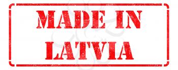 Made in Latvia inscription on Red Rubber Stamp Isolated on White.