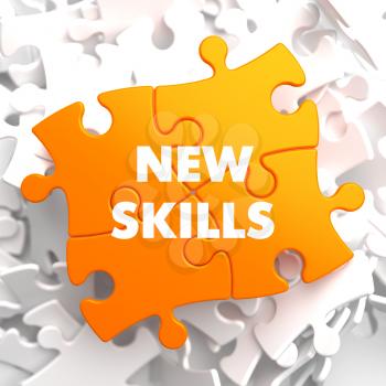 New Skills on Orange Puzzle on White Background.